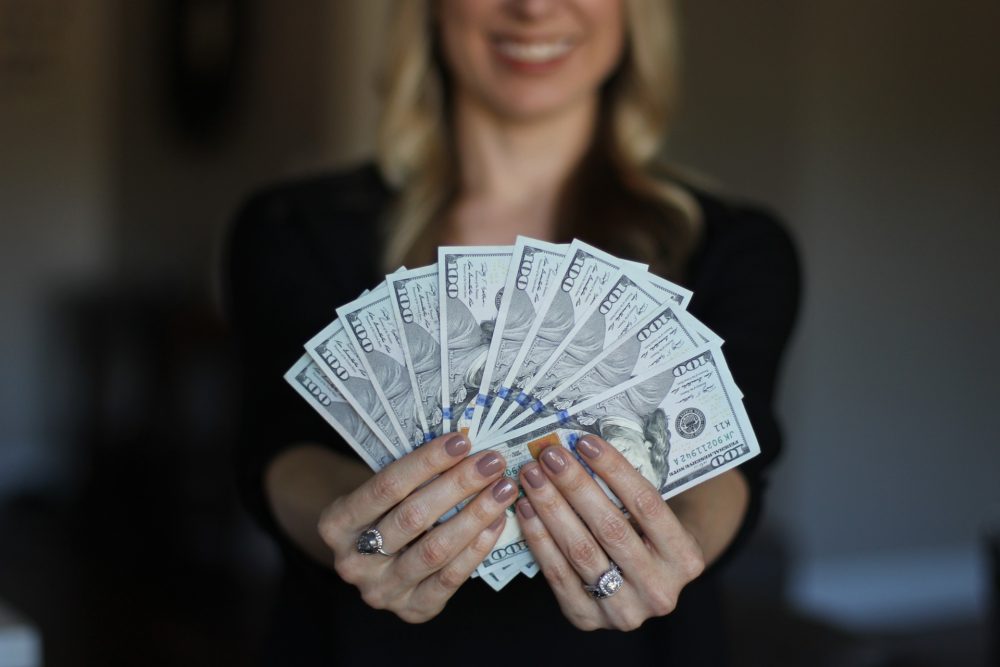 woman-holding-money